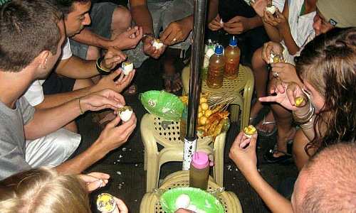Foreigners eating balut